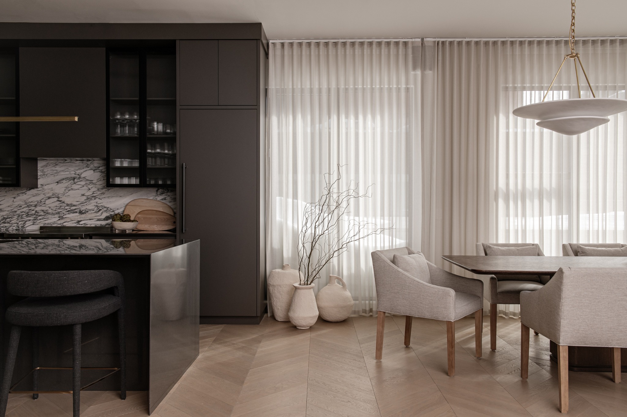 Dining area with European white oak chevron flooring